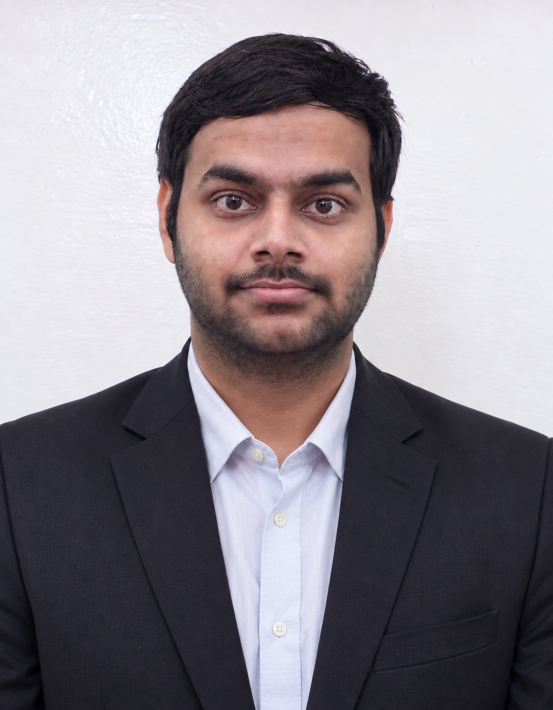 Portrait of Preetham S wearing a dark blazer